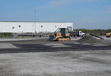 Slag and polymer surfacing for heavy duty industrial storage area.